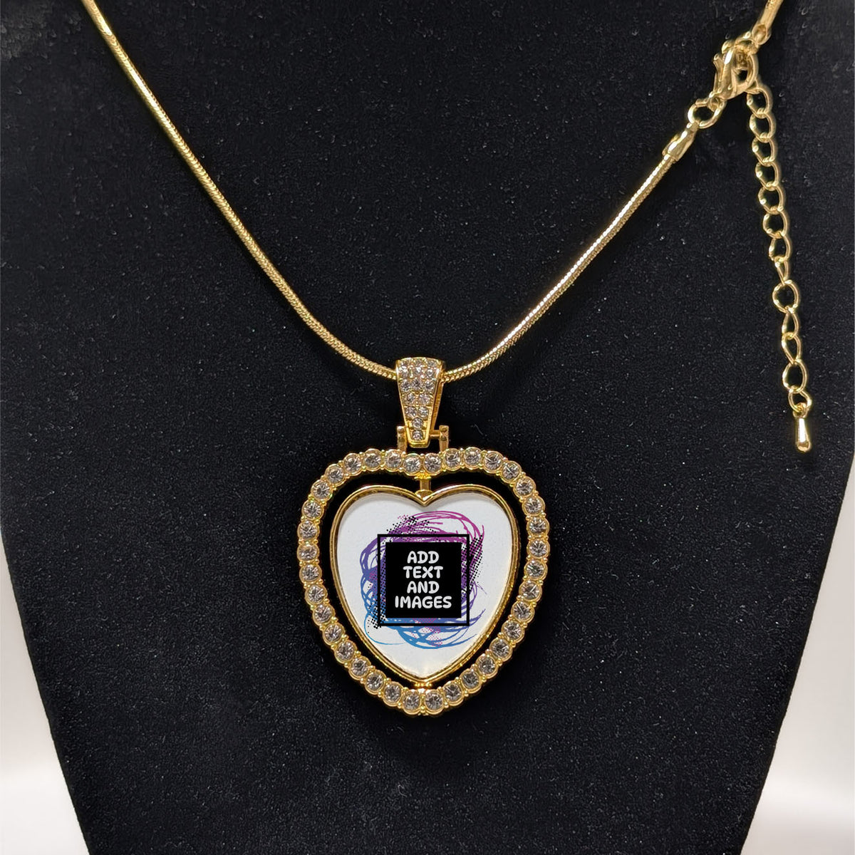 Customizable double-sided heart shaped gold rhinestone pendant with a gold necklace on a black stand