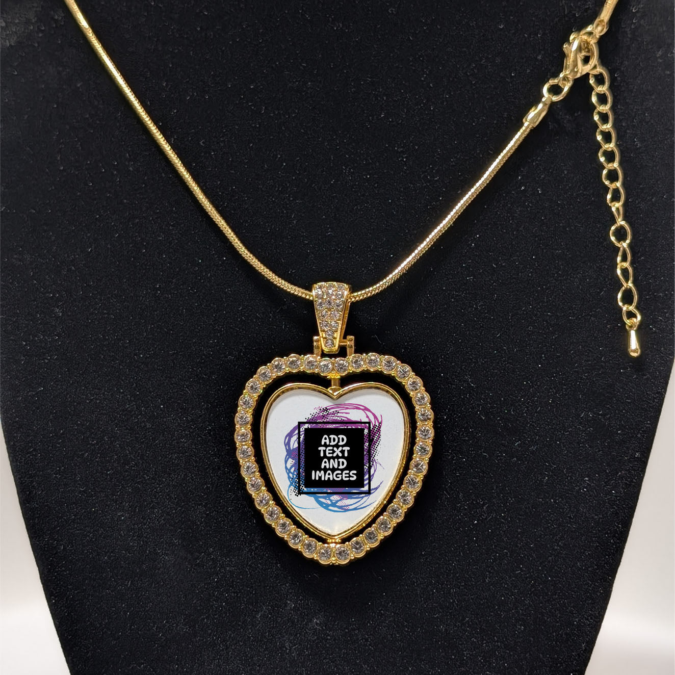 Customizable double-sided heart shaped gold rhinestone pendant with a gold necklace on a black stand