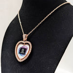 Customizable double-sided heart shaped rose gold rhinestone pendant with a rose gold necklace on a black stand