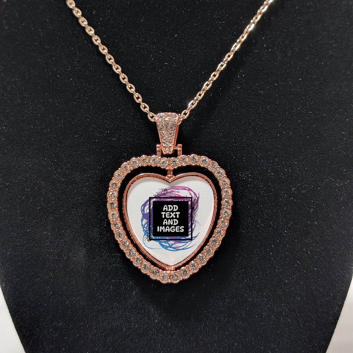 Customizable double-sided heart shaped rose gold rhinestone pendant with a rose gold necklace on a black stand