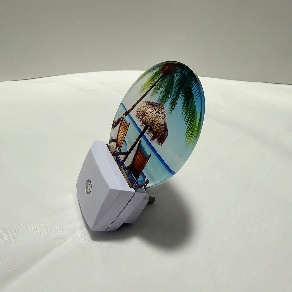 Night light with a beach scene design on a dark background