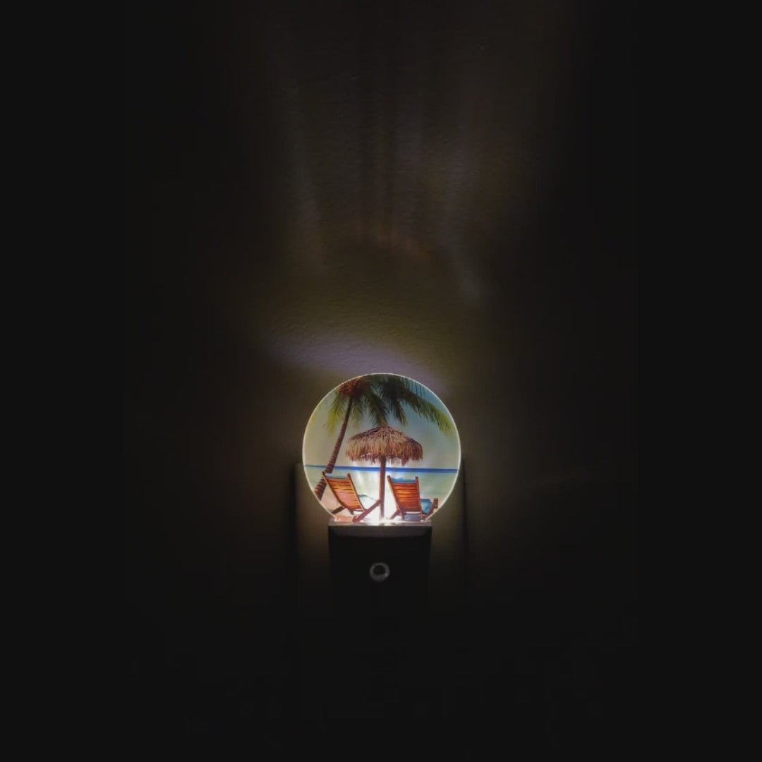 A video demonstrating the visual effect of this LED photo night light that shows a beautiful beach, ocean view and beach chairs.